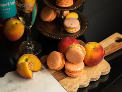 Enjoy <a href="https://everout.com/seattle/search/?q=lady%20yum">Lady Yum</a>'s peach prosecco macarons with your favorite fizzy wine.