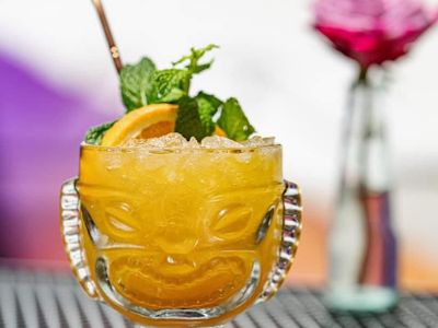 The East Compton Clovers, named for the winning cheer squad in Bring It On, comprises Doctor Bird Jamaican rum, Stiggins&rsquo; pineapple rum, a fruity amaro, apple-curry syrup, and sour OJ, and it&rsquo;s garnished with orange and mint. A rummy cornucopia of fruits.