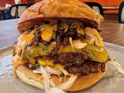 The allium-packed "Mr. Onion" smash burger, a menu item at <a class="add-to-list-link add-to-list-link" href="https://everout.com/portland-mercury/locations/jojo/l40293/" data-model="attractions.location" data-oid="40293">Jojo</a>'s new brick-and-mortar restaurant, has already been praised by the likes of <em>The Simpsons</em> writer Bill Oakley.