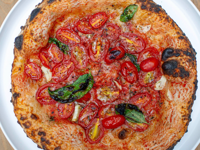 Grab a juicy pomodoro pie at <a class="add-to-list-link" href="https://everout.com/portland/locations/grana-pizza-napoletana/l43964/" data-model="attractions.location" data-oid="43964">Grana Pizza Napoletana</a>.