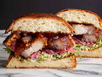 Sink your teeth into a pork belly sandwich at <a href="https://everout.com/seattle/locations/layers/l43628/">Layers Green Lake</a>.