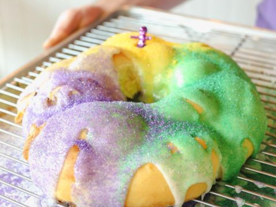 The New Orleans-inspired <a href="https://everout.com/locations/nola-doughnuts/l39556/">NOLA Doughnuts</a> is baking up buttery brioche king cakes for Mardi Gras.
