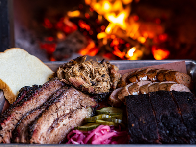 The Central District's popular <a href="https://everout.com/seattle/locations/wood-shop-bbq/l15185/">Wood Shop BBQ</a> smokes its meat with hickory from the Ozark Mountains and Post Oak wood from Texas.