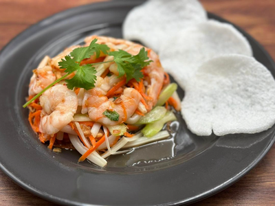 The Pearl District's <a href="https://everout.com/portland/locations/nom-nom-wings/l44577/">Nom Nom Wings</a> doesn't just sling wings&mdash;they also offer bites like this lotus stem salad with shrimp.