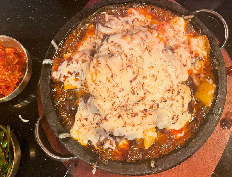 Bubbling Cauldrons of Cheese-Covered Meat