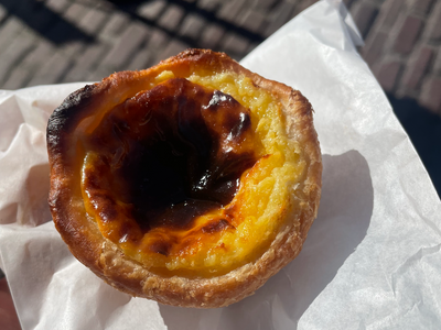 A Portuguese egg tart from the Pike Place stand <a href="https://everout.com/seattle/locations/lands-of-origin/l44807/">Lands of Origin</a>.