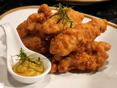 Dive into a plate of crispy lemongrass tempura wings with coconut galangal sauce at Belltown's newly opened <a href="https://everout.com/seattle/locations/kalabaw-bar-kitchen/l44973/">Kalabaw Bar &amp; Kitchen</a>.