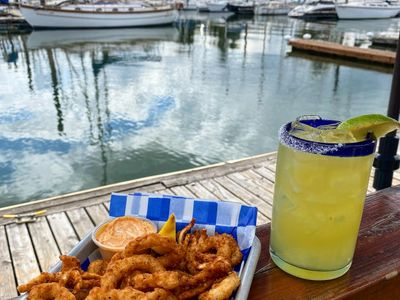 Relax alongside the waterfront with a margarita and calamari at <a href="https://everout.com/portland/locations/the-deck/l23177/">The Deck</a>.