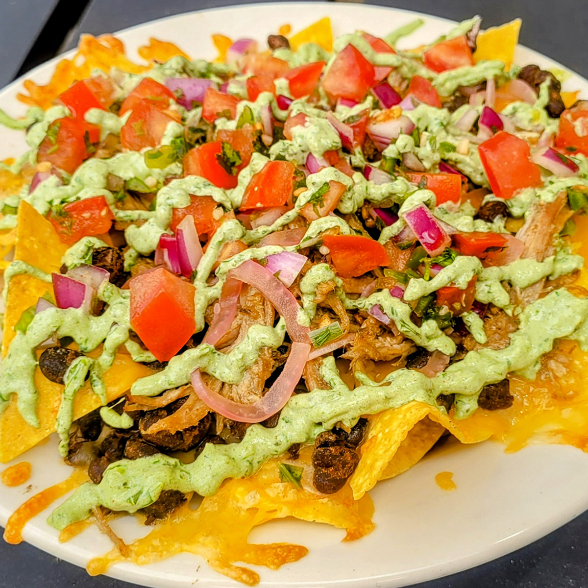 Pork Verde Nachos at Bucket Brigade Sports Bar & Restaurant in Portland ...