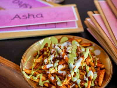 The Sudra has been reborn as <a href="https://everout.com/portland/locations/bar-asha/l45206/">Bar Asha</a>, serving cocktails and bar bites like chaat curry fries and Desi dogs.