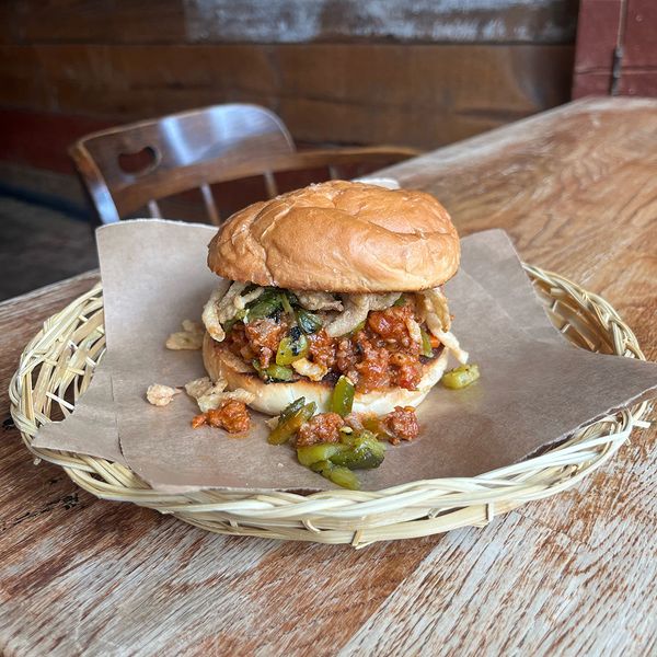 Beef and bacon Sloppy Joe with cowboy candy and fried onions