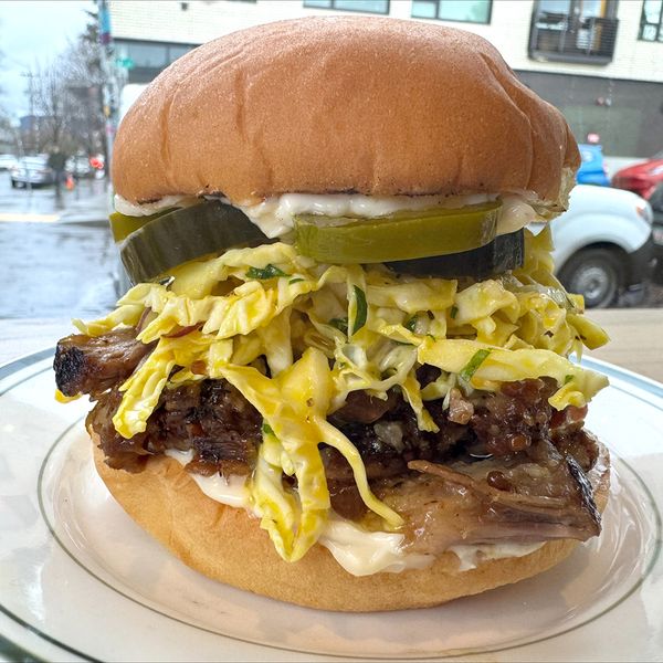 Smoked Pork Sandwich with IPA honey mustard spicy cabbage slaw and horseradish aioli